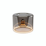 Lampadina LED donut E27 in vetro fumé, Ø 120 mm, accesa, anello luminoso caldo, sfondo bianco