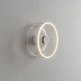 Lampadina LED donut E27 in vetro trasparente, Ø 195 mm, accesa come applique in un interno essenziale