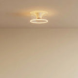 Lampadina LED donut E27 in vetro trasparente, Ø 195 mm, accesa a soffitto in un interno essenziale