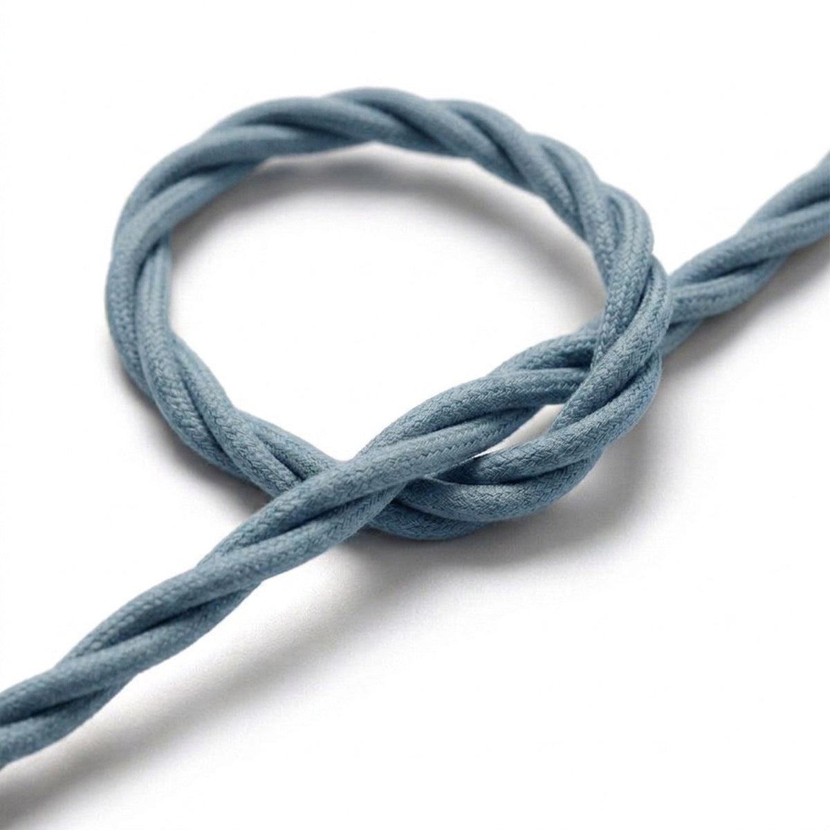 Primo piano del cavo tessile intrecciato, cotone blu oceano