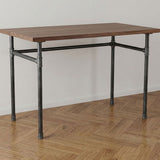 Scrivania industriale con piano in noce su base a U in ghisa e acciaio Ø 27 mm, ambientazione (piano non incluso)